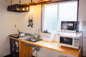 Una cocina o kitchenette en FUJIクロスゲートハウス