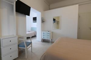 Postel nebo postele na pokoji v ubytování Hotel La Tavernetta