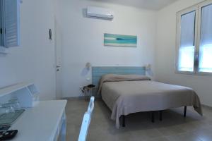 Postel nebo postele na pokoji v ubytování Hotel La Tavernetta