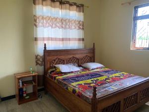 Katil atau katil-katil dalam bilik di Kae Holiday Home +6 gambar