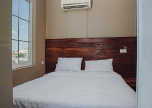 Postel nebo postele na pokoji v ubytování BML Highway Hotel + 37 fotografií