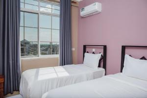 Postel nebo postele na pokoji v ubytování BML Highway Hotel