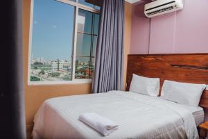 Postel nebo postele na pokoji v ubytování BML Highway Hotel