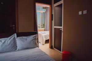 Postel nebo postele na pokoji v ubytování BML Highway Hotel