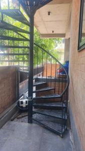 a group of stairs in a building next to a building at Earthy - Vintage in Shimoga