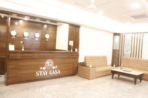a lobby with astay csi sign on the wall at Hotel Stay Casa in Bhopal