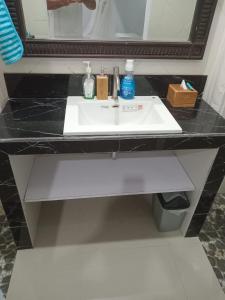 a bathroom counter with a sink and a mirror at Pondok Dauh Ancak in Tabanan +15 photos