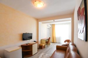 TV a/nebo společenská místnost v ubytování Hotel Rio
