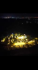 a view of a city at night with lights at Phrao Camping Village พร้าวแคมป์ปิ้ง วิลเลจ in Ban Nong Hai