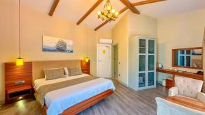 Postel nebo postele na pokoji v ubytování Göcek Centre Hotel + 37 fotografií