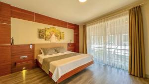 A bed or beds in a room at Göcek Centre Hotel