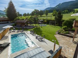 an overhead view of a swimming pool in a yard at Grittlmühle Chalet Ferienwohnungen in Brixen im Thale