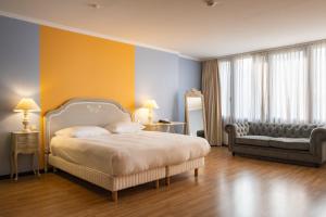 Ένα ή περισσότερα κρεβάτια σε δωμάτιο στο Hotel Parc Belle-Vue