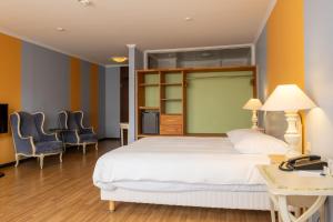 Ένα ή περισσότερα κρεβάτια σε δωμάτιο στο Hotel Parc Belle-Vue