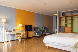 Ένα ή περισσότερα κρεβάτια σε δωμάτιο στο Hotel Parc Belle-Vue