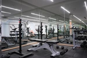 a gym with a lot of equipment in a room at Hilton Garden Inn Pune Hinjawadi in Pune