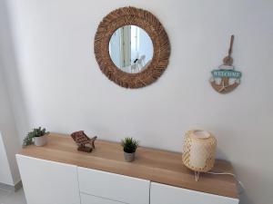 a mirror on top of a dresser in a room at Urbanización Altos de Nuevo Vera in Vera