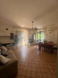 a living room with a couch and a table at Villa Girasole Luxury Amalfi Coast in Minori