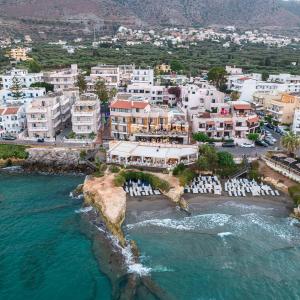 an aerial view of a resort on the beach at Porto Greco Village Beach Hotel in Hersonissos