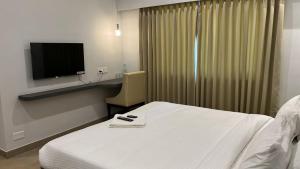 Hotel GSR Tumkur客房内的一张或多张床位