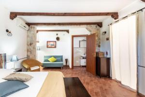 a bedroom with a bed and a bathroom at Alle Riserve Vendicari Country House in Noto