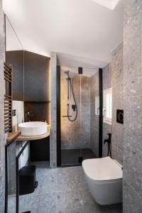 a bathroom with a sink and a toilet and a shower at Penthouse ❤ Verona ✔ Arena@5min ✔ Self Check-In in Verona