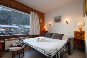 Katil atau katil-katil dalam bilik di Résidence le Chardonnet D - Happy Rentals +8 gambar