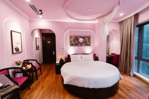 Postel nebo postele na pokoji v ubytování A&D Luxury Hotel