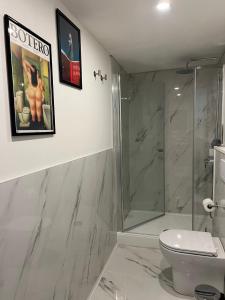a bathroom with a shower and a toilet at La Matilde in Viareggio