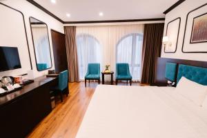 Postel nebo postele na pokoji v ubytování A&D Luxury Hotel
