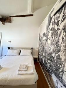a bedroom with a bed with two towels on it at La Matilde in Viareggio