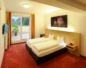TV a/nebo společenská místnost v ubytování Austria Classic Hotel Heiligkreuz