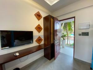 TV a/nebo společenská místnost v ubytování DownTown Hostels - Anjuna