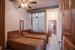 Ένα ή περισσότερα κρεβάτια σε δωμάτιο στο Attard Seafront Apartment 6 in Marsalforn