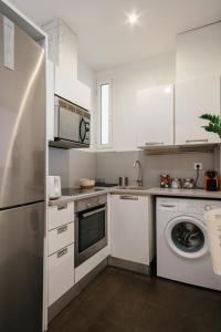 Kuchyň nebo kuchyňský kout v ubytování Cute Apartment