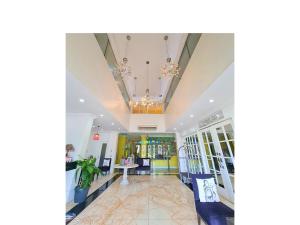 a lobby of a store with chandeliers at Fiesta Garden Hotel by SMS Hospitality in Vigan