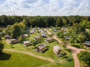 an aerial view of a farm with a group of tents at Huttopia Calvados - Normandie in Moyaux