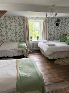 A bed or beds in a room at The Pink House