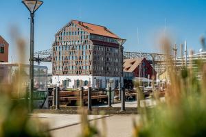 a large building in the middle of a city at Old Mill Hotel in Klaipėda