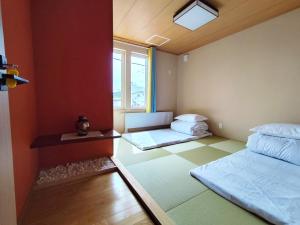 Postel nebo postele na pokoji v ubytování White House Guesthouse