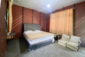 Ένα ή περισσότερα κρεβάτια σε δωμάτιο στο Hotel Pantai Panjang Bengkulu RedPartner