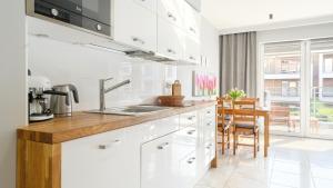 Dapur atau dapur kecil di Apartamenty Sun & Snow Wasterplatte