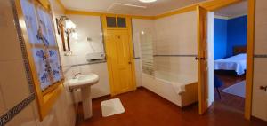 a bathroom with a sink and a shower at Casa do Fundo - Sustainable & Ecotourism in Seia