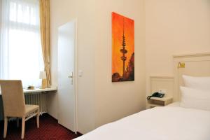 Postel nebo postele na pokoji v ubytování Hotel Fürst Bismarck