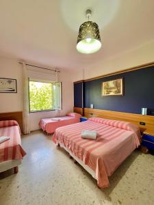 Postel nebo postele na pokoji v ubytování Hotel Praja