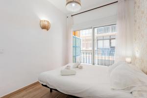 Postel nebo postele na pokoji v ubytování Malaga centro