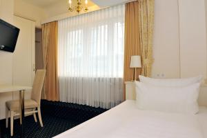 Postel nebo postele na pokoji v ubytování Hotel Fürst Bismarck