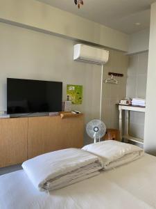 Rúm í herbergi á Chuxu Homestay