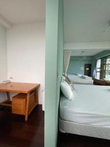 Rúm í herbergi á Chuxu Homestay