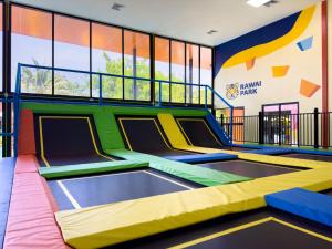 an indoor trampoline park with a slide at Rawayana Central Park Villas in Rawai Beach